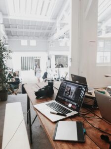 Modern creative studio setup with designer desk and branding wall in 2025