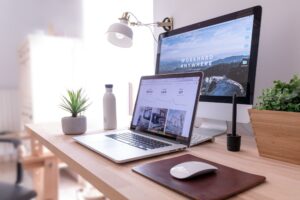 Personalized UX dashboard in 2025 showing AI-driven recommendations and dynamic UI on laptop and phone.