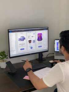 UI/UX designer creating mobile-first interface on smartphone screen, representing design trends in 2025